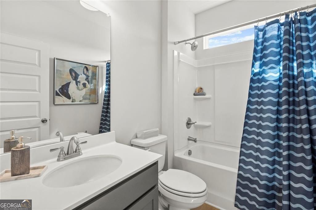 105 Roy Drive Calhoun, GA 30701 - Photo 20 of 28 a bathroom with a sink toilet and shower