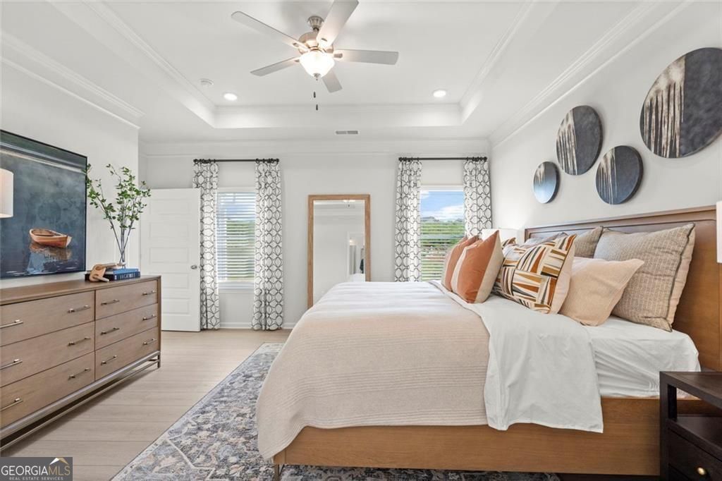 105 Roy Drive Calhoun, GA 30701 - Photo 24 of 28 a bedroom with a large bed and a window