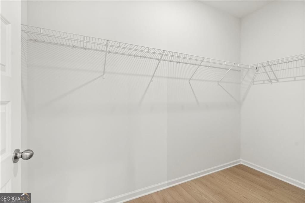 105 Roy Drive Calhoun, GA 30701 - Photo 25 of 28 a view of a room with racks on the wall