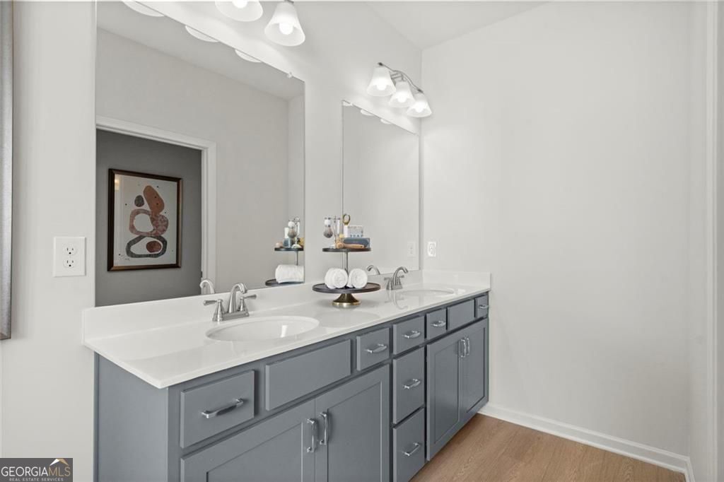 105 Roy Drive Calhoun, GA 30701 - Photo 27 of 28 a bathroom with a sink vanity and a mirror
