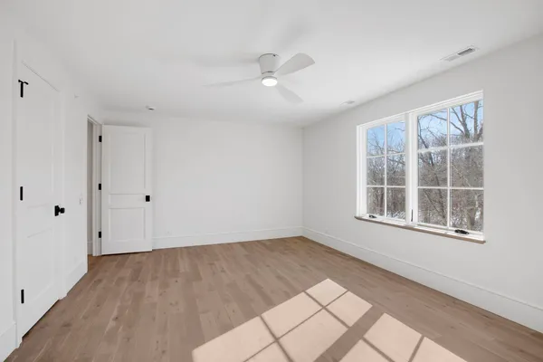 a view of an empty room with windows