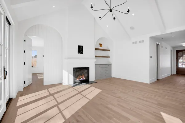 a view of livingroom with a fireplace cabinet and windows