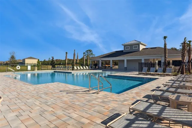 a view of a pathway with a wrought fence
