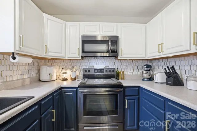 a bedroom with a bed and a tv