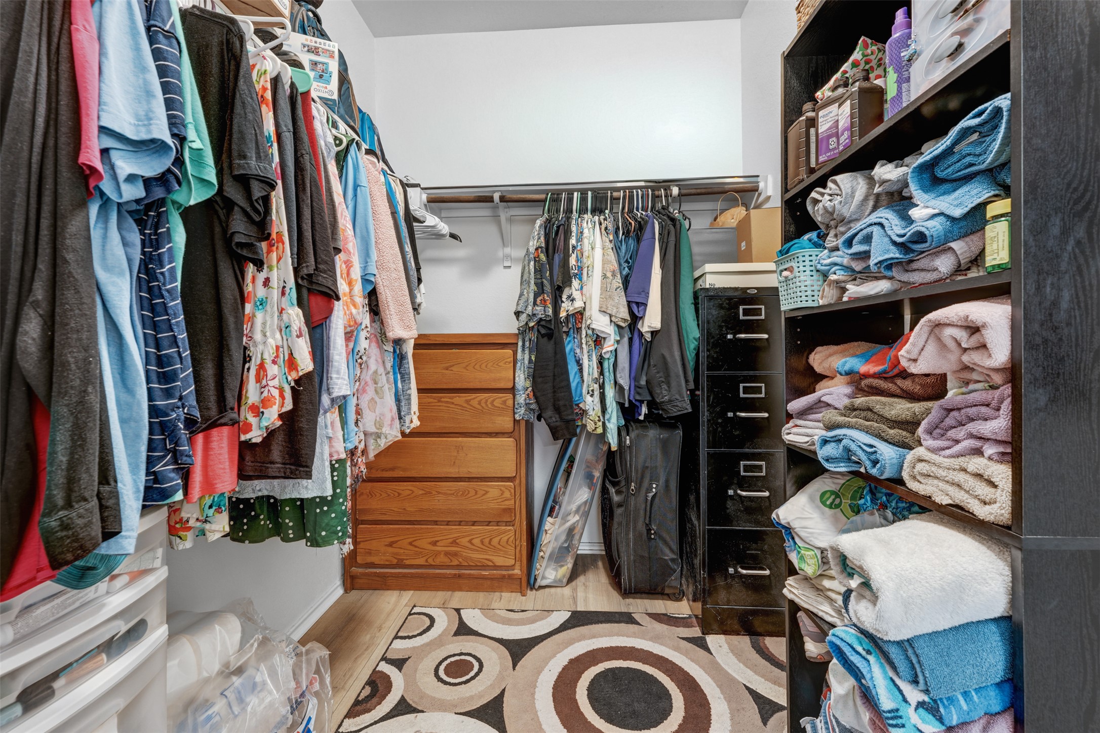 413 Perfect World Loop Jarrell, TX 76537 - Photo 21 of 39 Discover optimal organization within this well-appointed closet, featuring extensive hanging space and convenient built-in shelving.