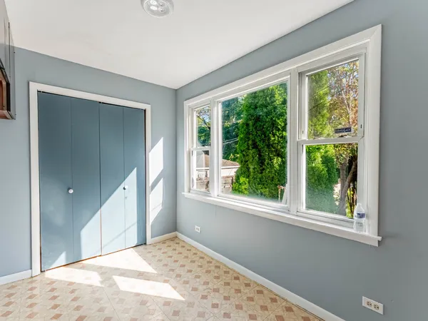 a view of an empty room and window