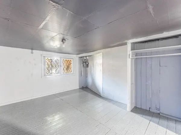 a view of a room with white walls