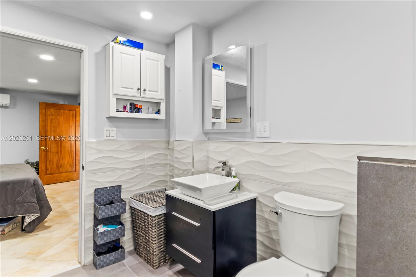 6250 Southwest 20th Terrace Miami, FL 33155 - Photo 29 of 42 a bathroom with a sink a toilet and a mirror