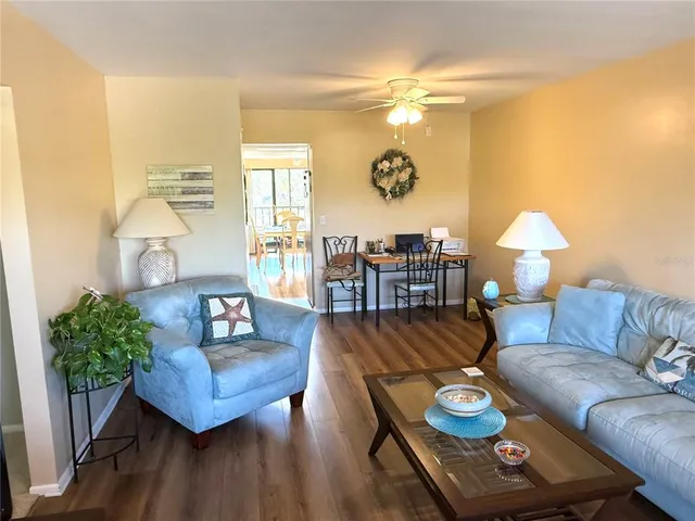 a living room with furniture and a table