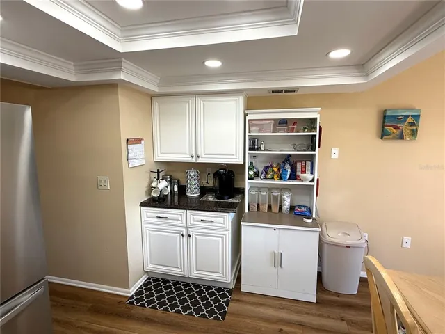 a kitchen with a sink and wooden cabinets