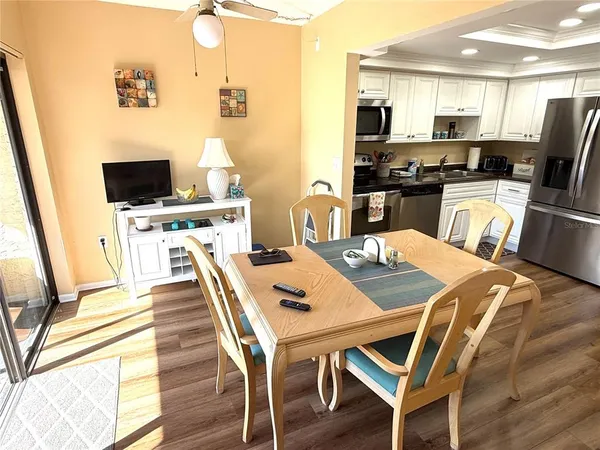 a view of a dining room with furniture and wooden floor