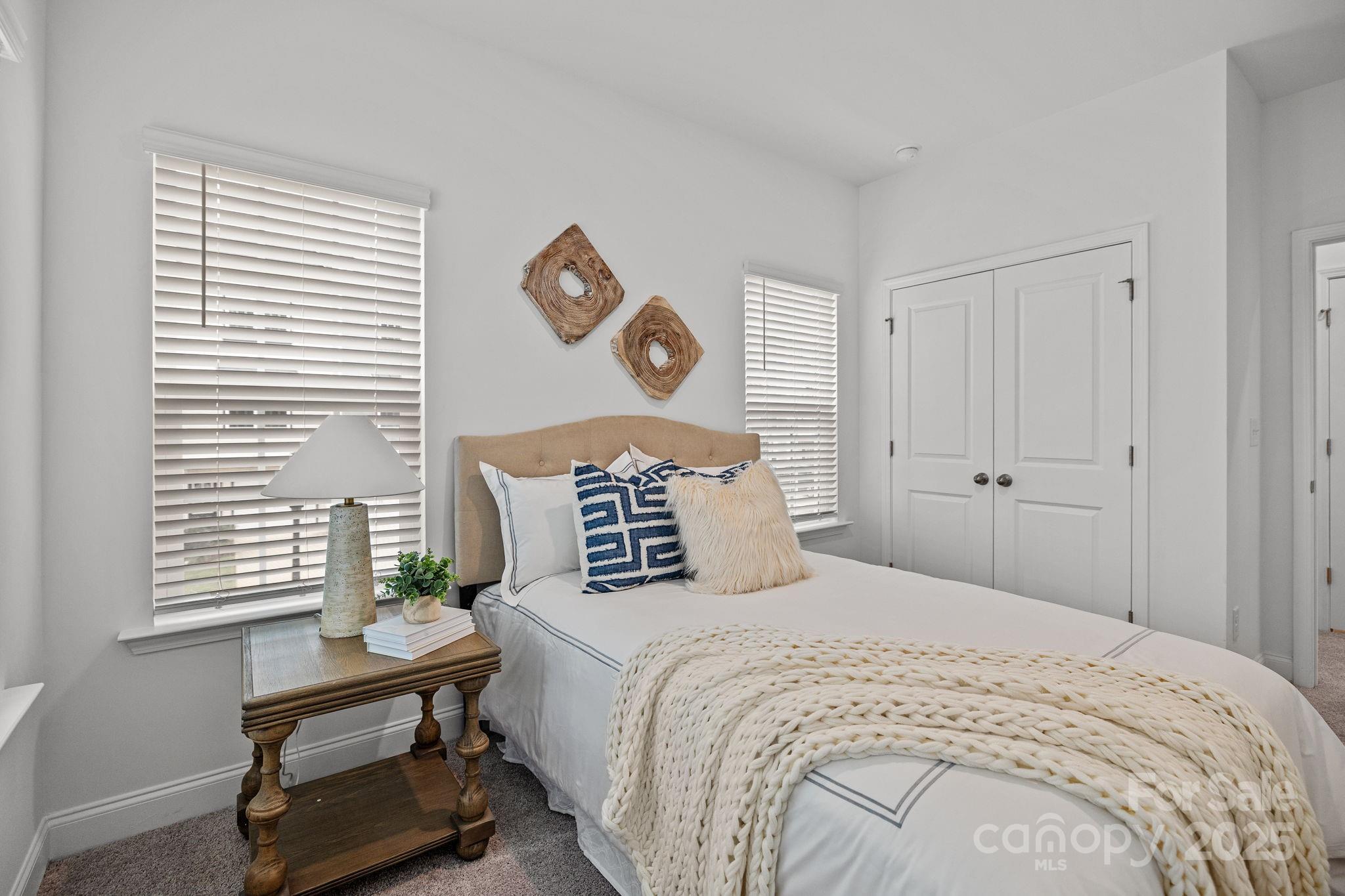 5025 Cherry Gum Court, Unit 47 Matthews, NC 28105 - Photo 18 of 27 a bedroom with a bed and a window