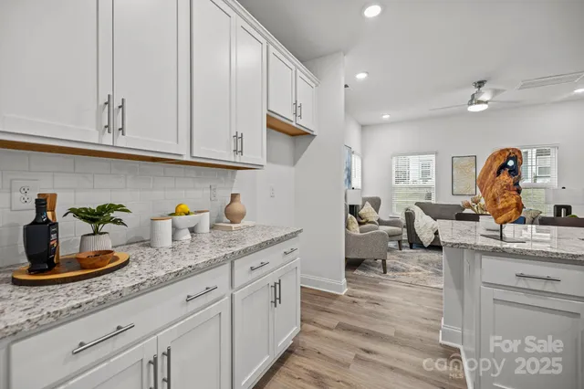 a kitchen with cabinets a sink and appliances