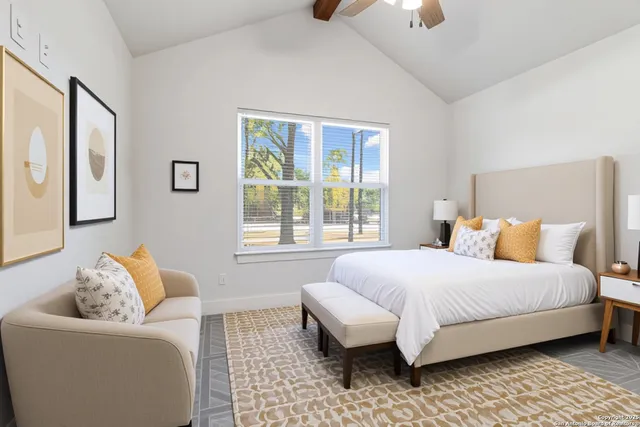 a bedroom with a bed and lamp