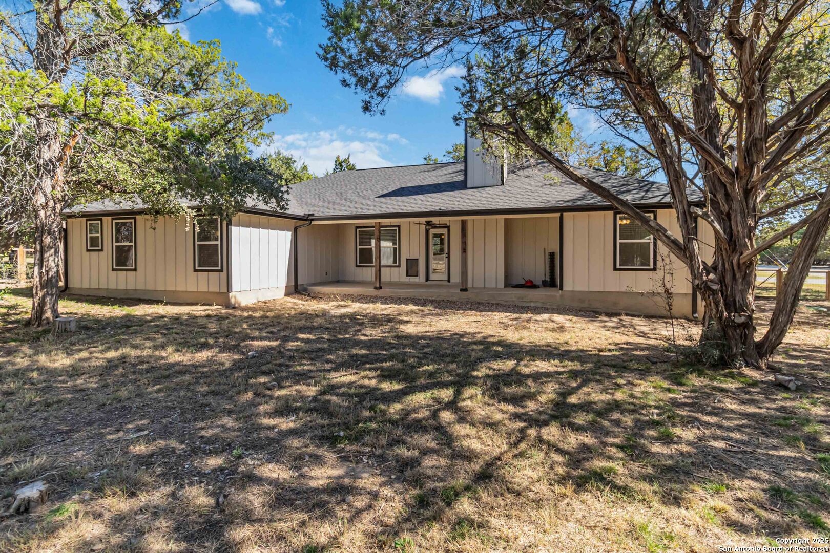 188 Old Camp Road Bandera, TX 78003 - Photo 23 of 36 front view of a house with a yard