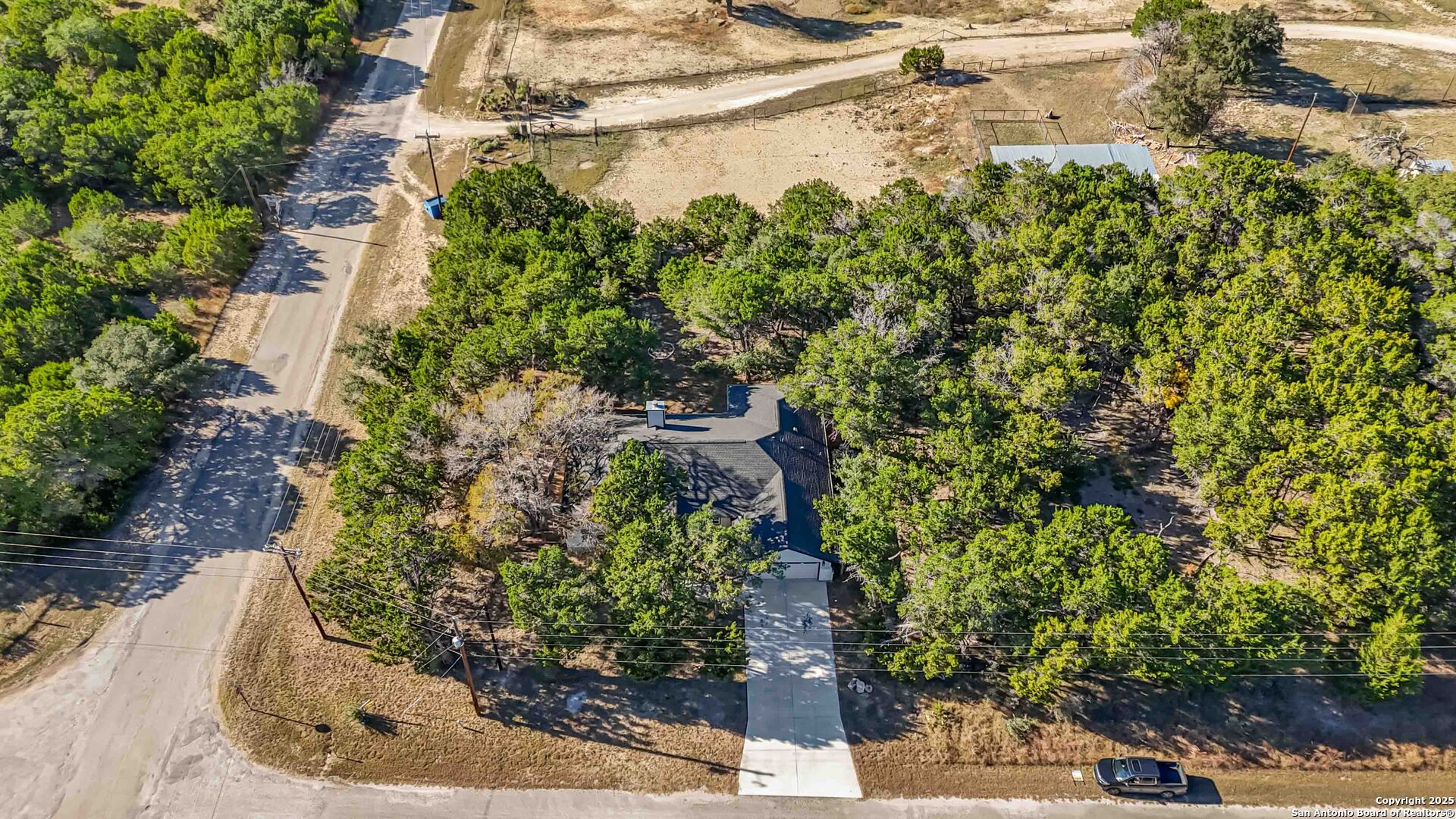 188 Old Camp Road Bandera, TX 78003 - Photo 26 of 36 a view of a garden with a bench