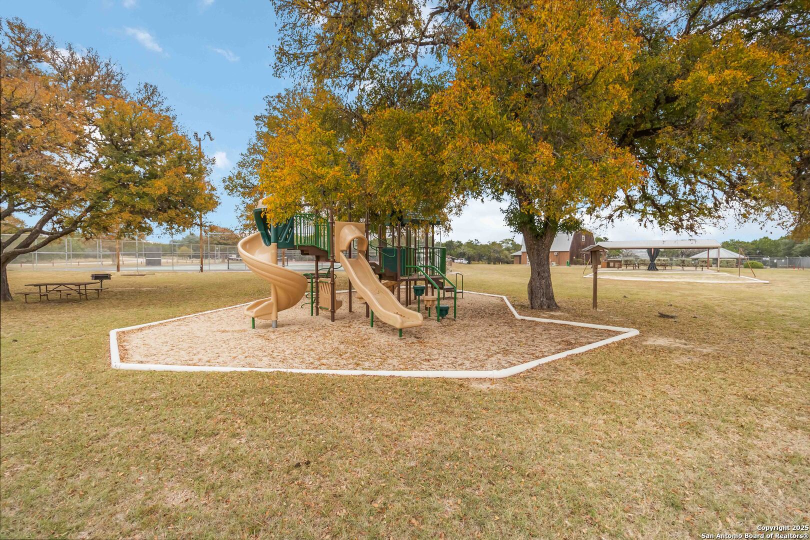 188 Old Camp Road Bandera, TX 78003 - Photo 28 of 36 a view of a water fountain with large trees