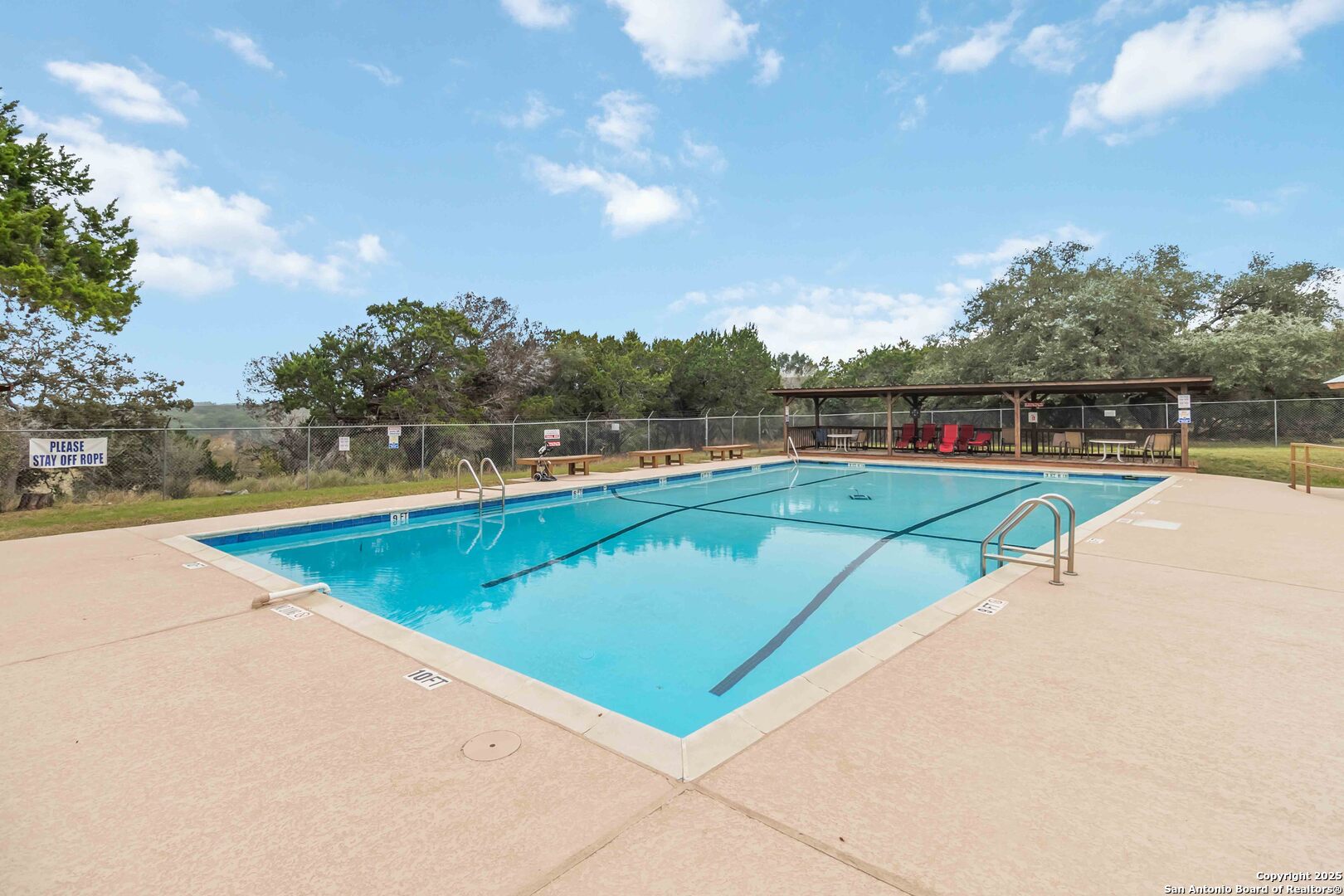 188 Old Camp Road Bandera, TX 78003 - Photo 31 of 36 a view of swimming pool with a yard
