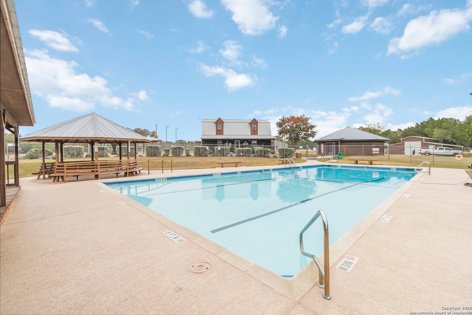 188 Old Camp Road Bandera, TX 78003 - Photo 33 of 36 a view of a swimming pool and a terrace