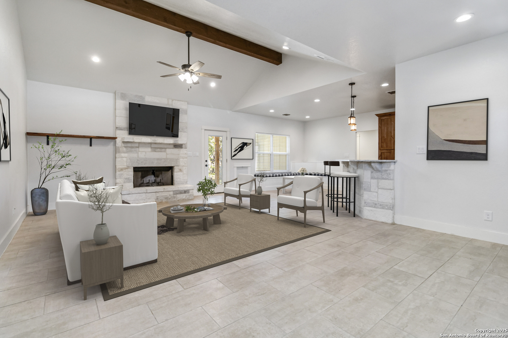 188 Old Camp Road Bandera, TX 78003 - Photo 4 of 36 a living room with furniture and a fireplace