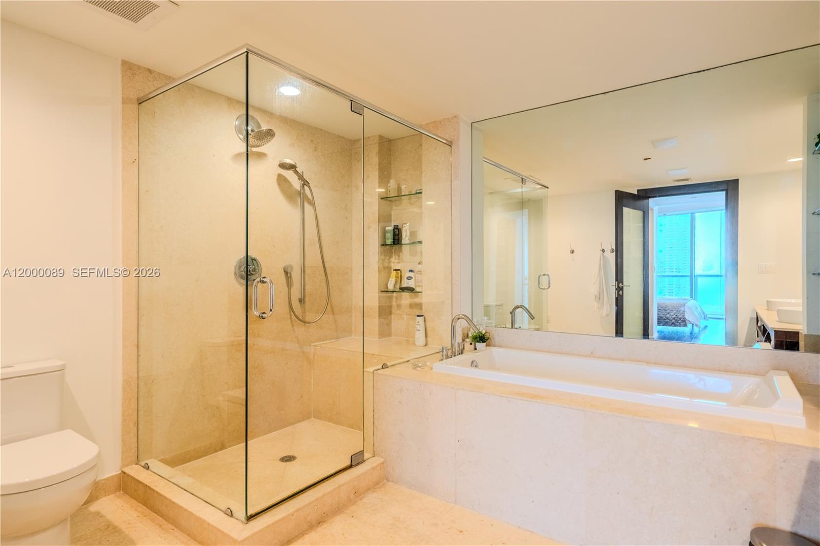 495 Brickell Avenue, Unit PH5703 Miami, FL 33131 - Photo 15 of 52 Master Suite bath with a separate standing shower and tub, 2 sinks.