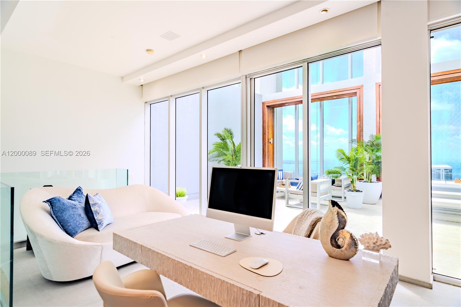 495 Brickell Avenue, Unit PH5703 Miami, FL 33131 - Photo 25 of 52 Upper floor office - opens to outside patio, ocean view