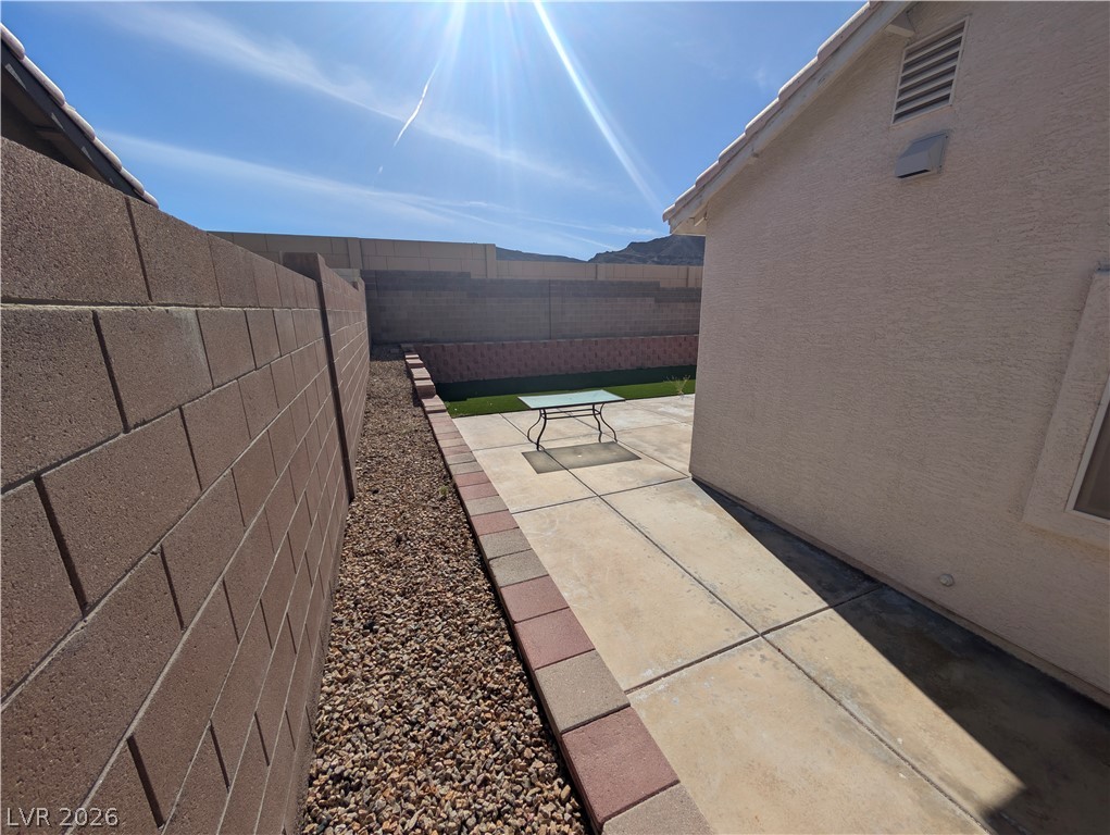 104 Appian Way Henderson, NV 89002 - Photo 25 of 37 Fenced backyard featuring a patio area