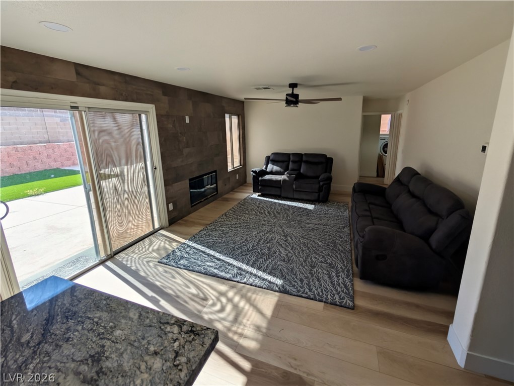104 Appian Way Henderson, NV 89002 - Photo 28 of 37 Living room with light wood-style flooring and a ceiling fan