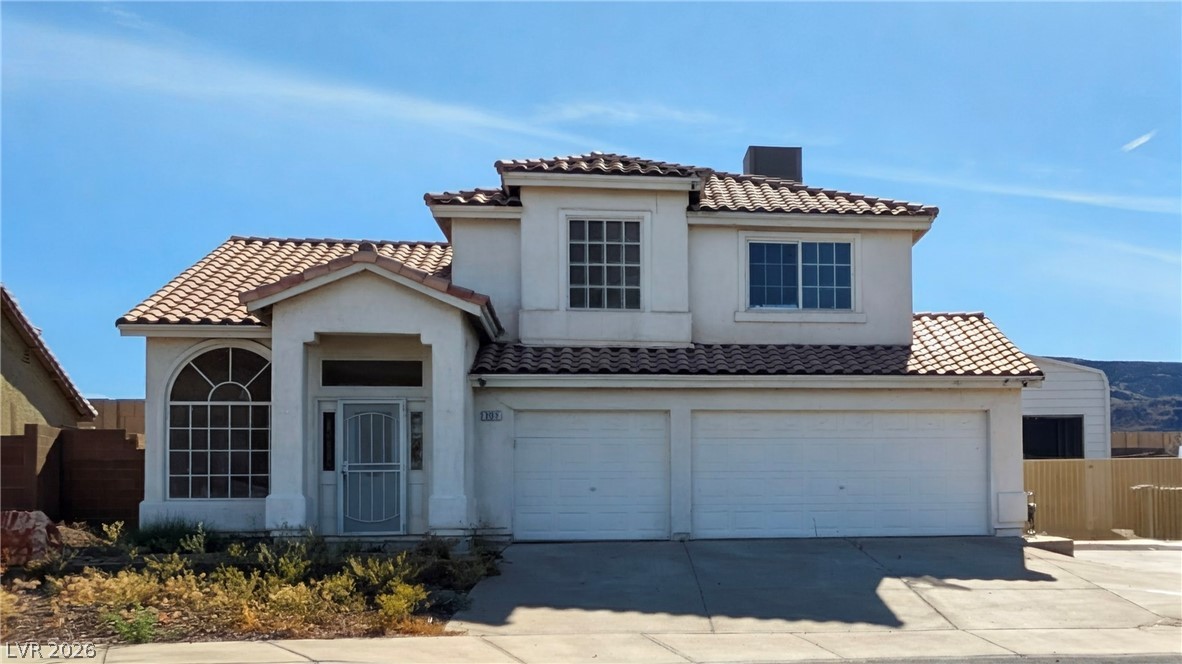 104 Appian Way Henderson, NV 89002 - Photo 3 of 37 Mediterranean / spanish-style home featuring an attached garage, concrete driveway, a tile roof, and stucco siding