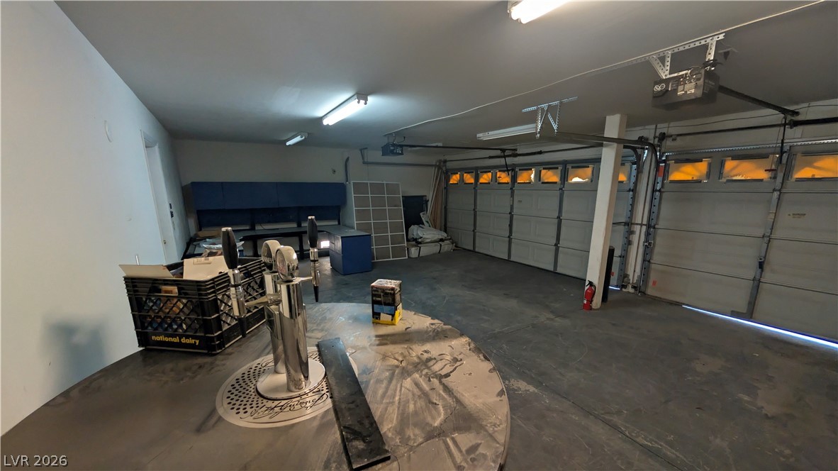 104 Appian Way Henderson, NV 89002 - Photo 32 of 37 Garage with a garage door opener
