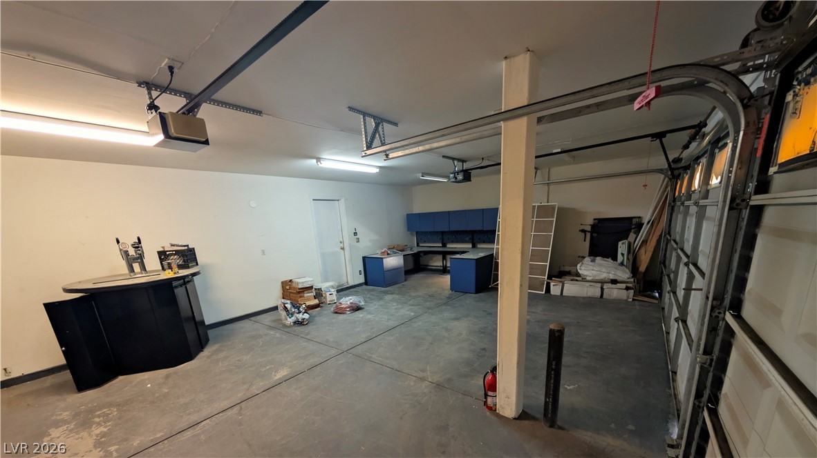 104 Appian Way Henderson, NV 89002 - Photo 33 of 37 Garage featuring a garage door opener