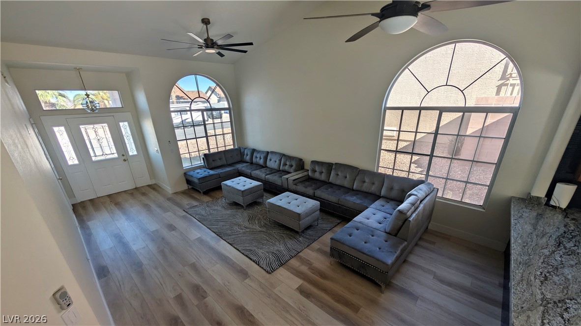 104 Appian Way Henderson, NV 89002 - Photo 6 of 37 Living area with ceiling fan, wood finished floors, and plenty of natural light