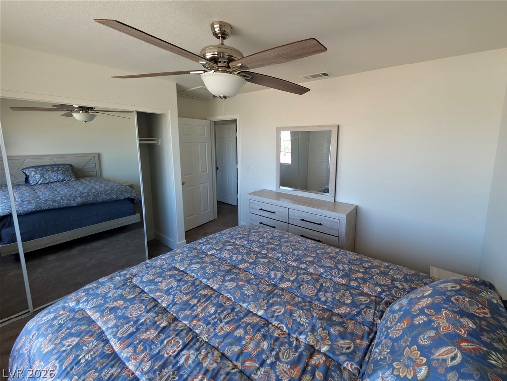 104 Appian Way Henderson, NV 89002 - Photo 9 of 37 Bedroom featuring ceiling fan and a closet
