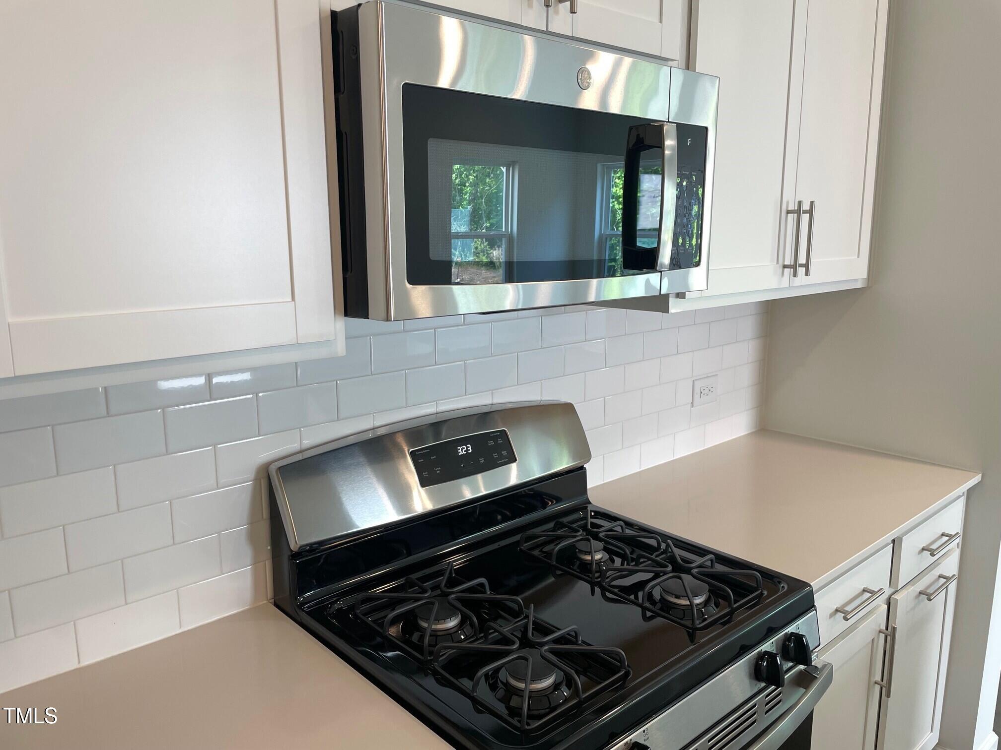 3019 Vitner Drive Durham, NC 27704 - Photo 10 of 20 a stove top oven sitting inside of a kitchen