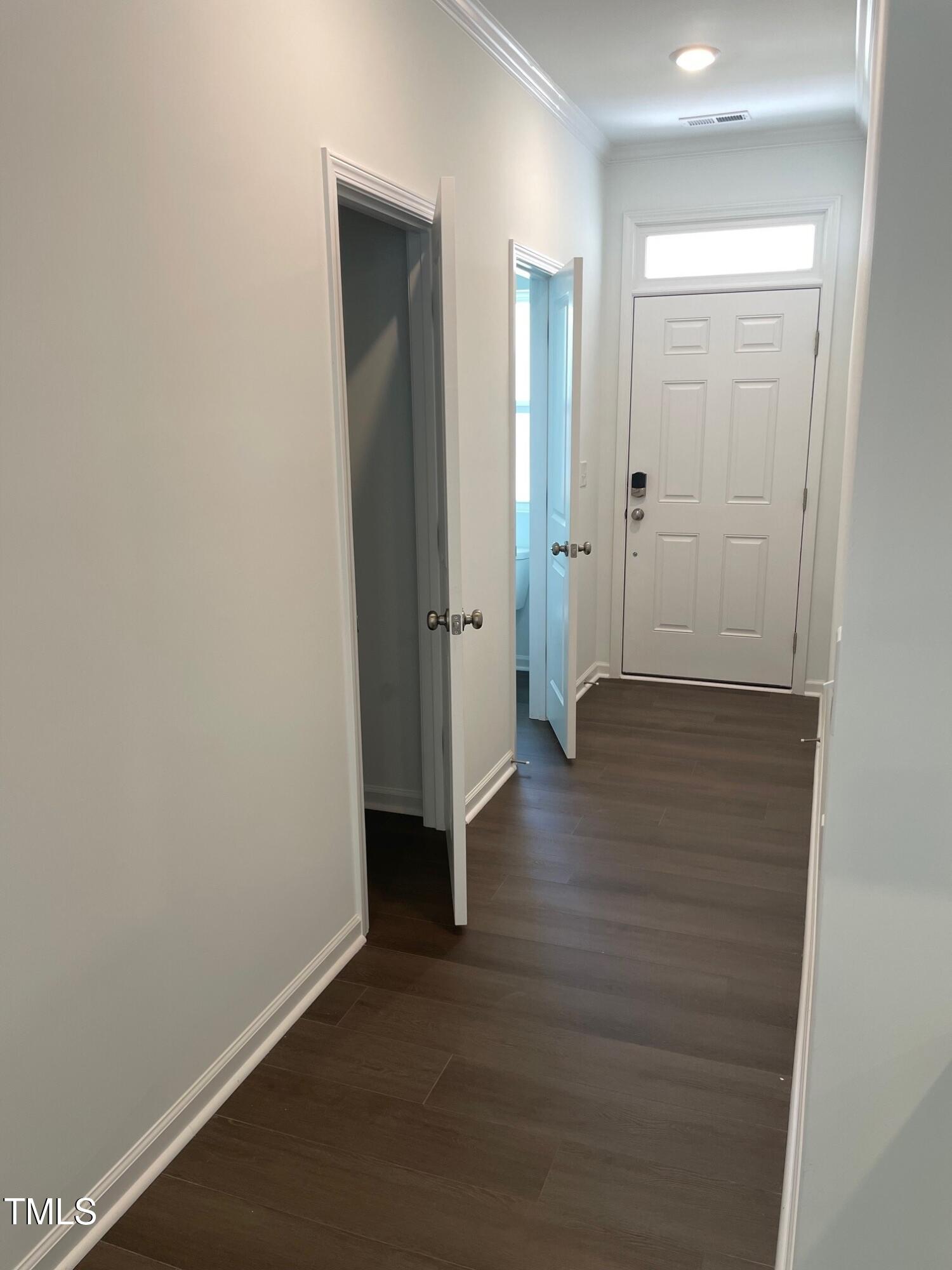 3019 Vitner Drive Durham, NC 27704 - Photo 4 of 20 a view of an empty room with wooden floor and a bathroom