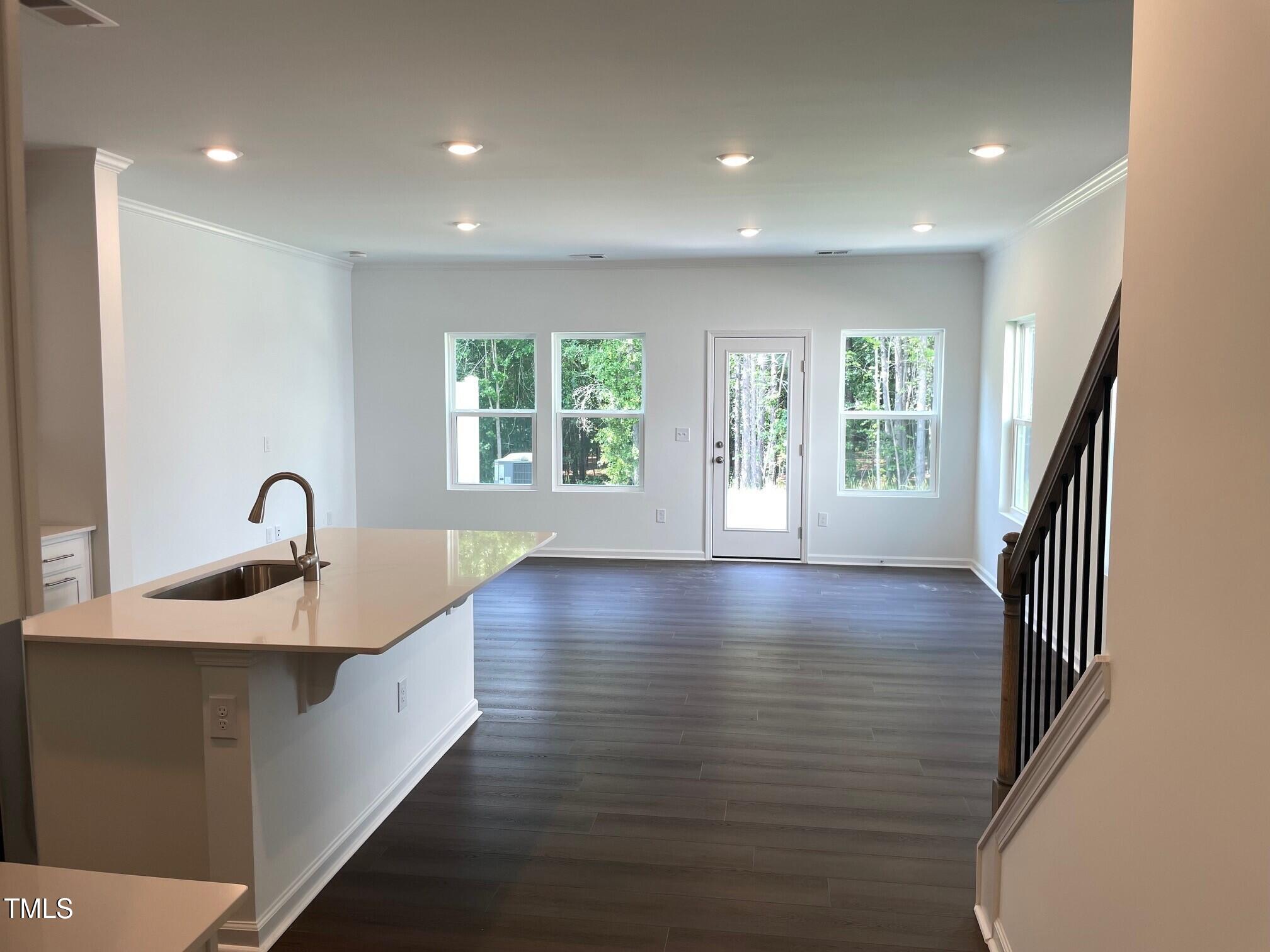 3019 Vitner Drive Durham, NC 27704 - Photo 7 of 20 a view of an empty room with wooden floor and a window