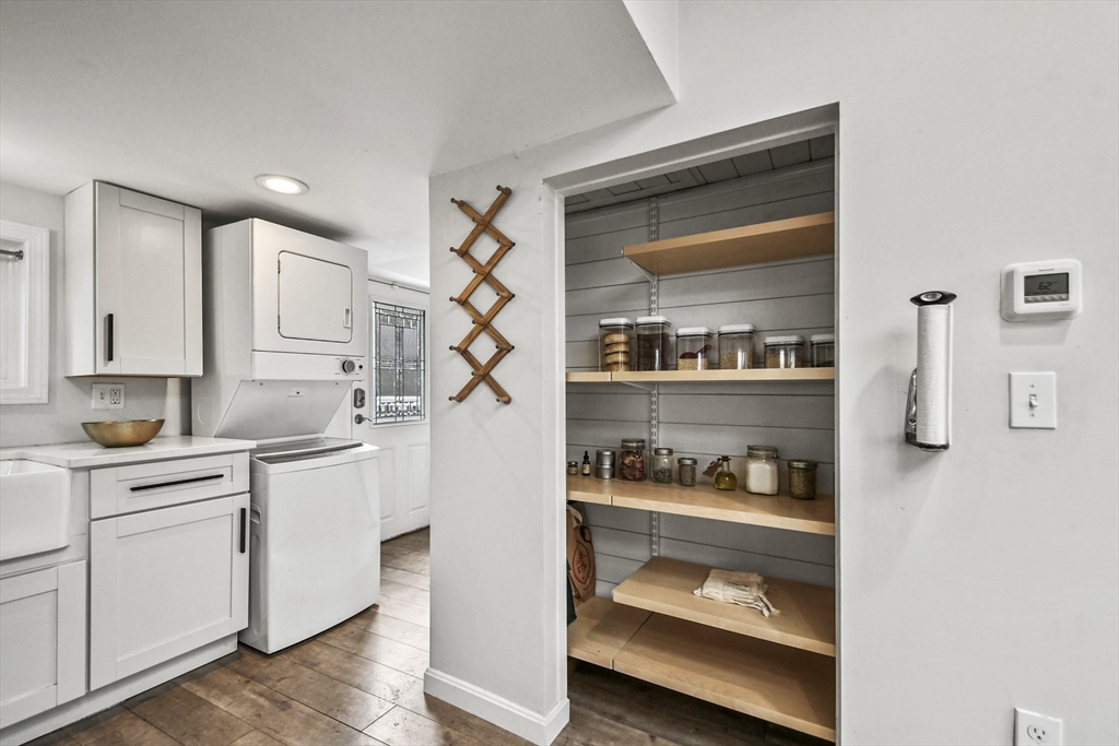 8 Hitty Road Salem, NH 03079 - Photo 14 of 26 a kitchen with white cabinets and white appliances