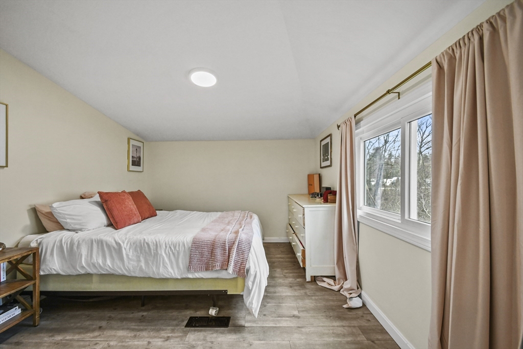 8 Hitty Road Salem, NH 03079 - Photo 15 of 26 a bedroom with a bed and wooden floor