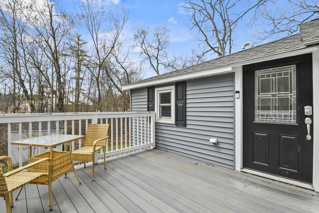 8 Hitty Road Salem, NH 03079 - Photo 19 of 26 a view of a deck with wooden floor and fence