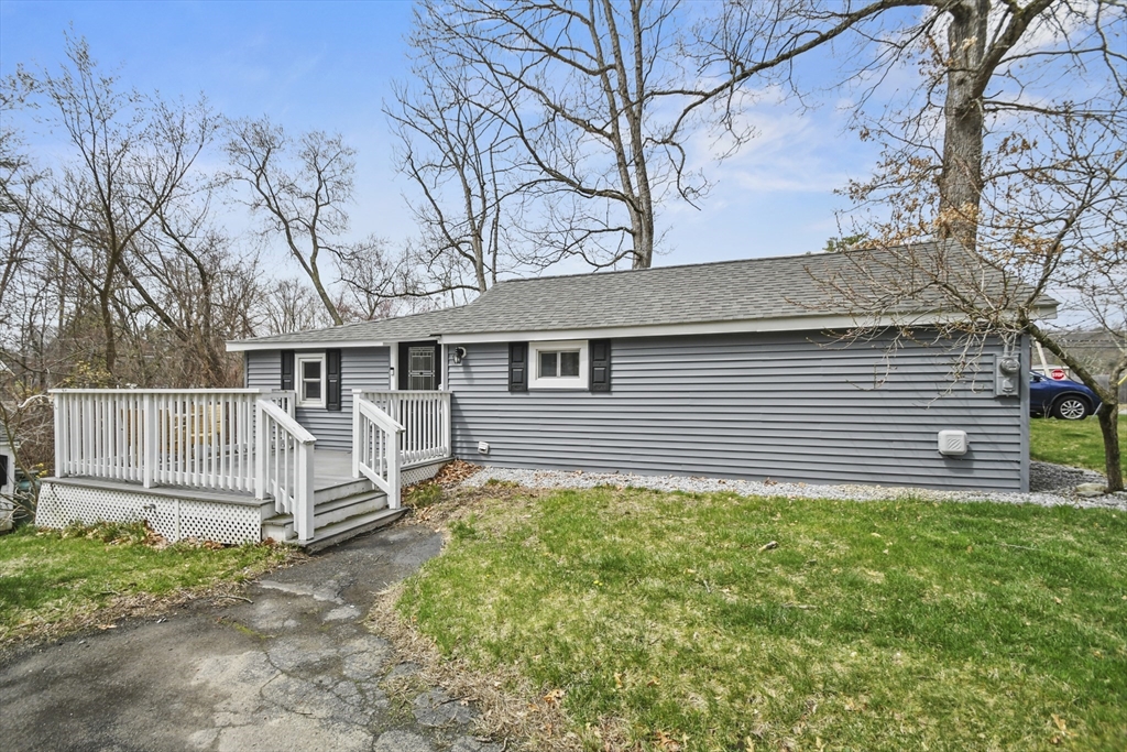 8 Hitty Road Salem, NH 03079 - Photo 21 of 26 a backyard of a house with table and chairs