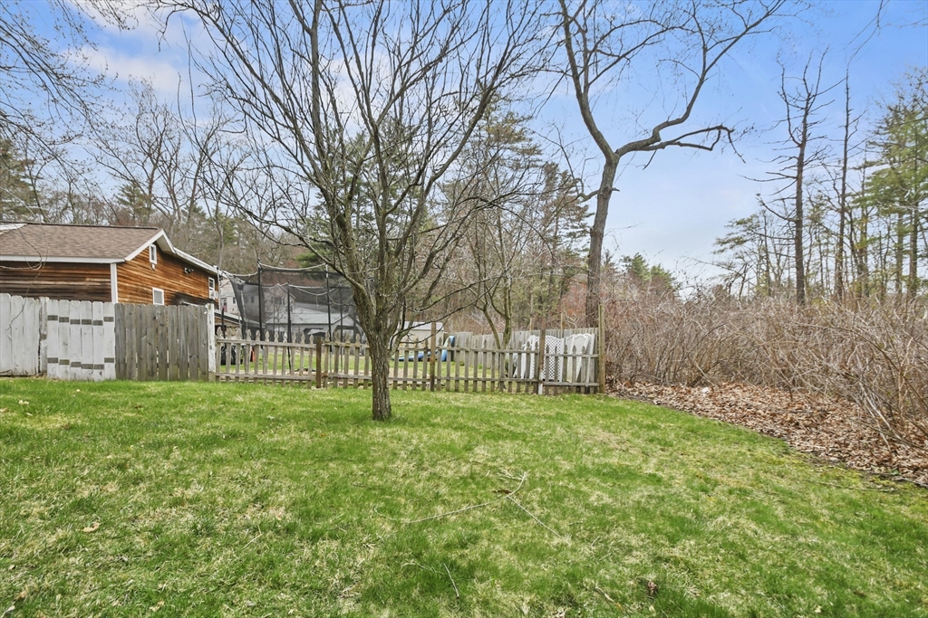 8 Hitty Road Salem, NH 03079 - Photo 24 of 26 a view of a yard with a house in the background