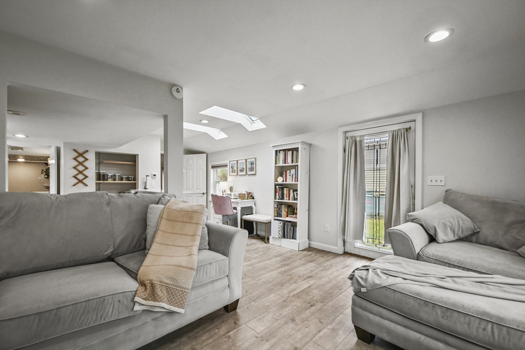 8 Hitty Road Salem, NH 03079 - Photo 6 of 26 a living room with furniture and wooden floor