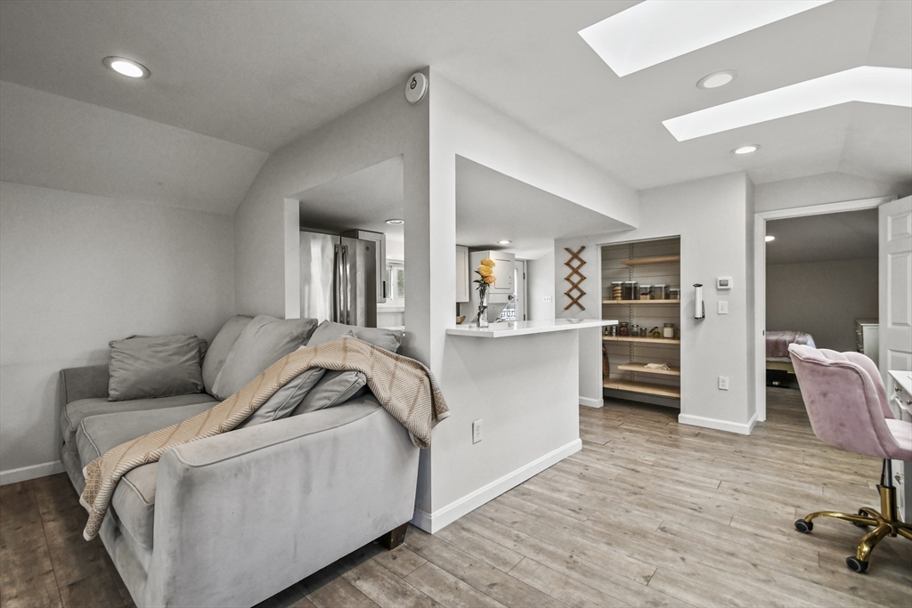 8 Hitty Road Salem, NH 03079 - Photo 7 of 26 a living room with furniture and a wooden floor