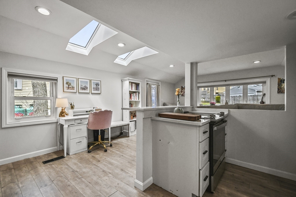 8 Hitty Road Salem, NH 03079 - Photo 10 of 26 a kitchen with granite countertop a sink cabinets and wooden floor