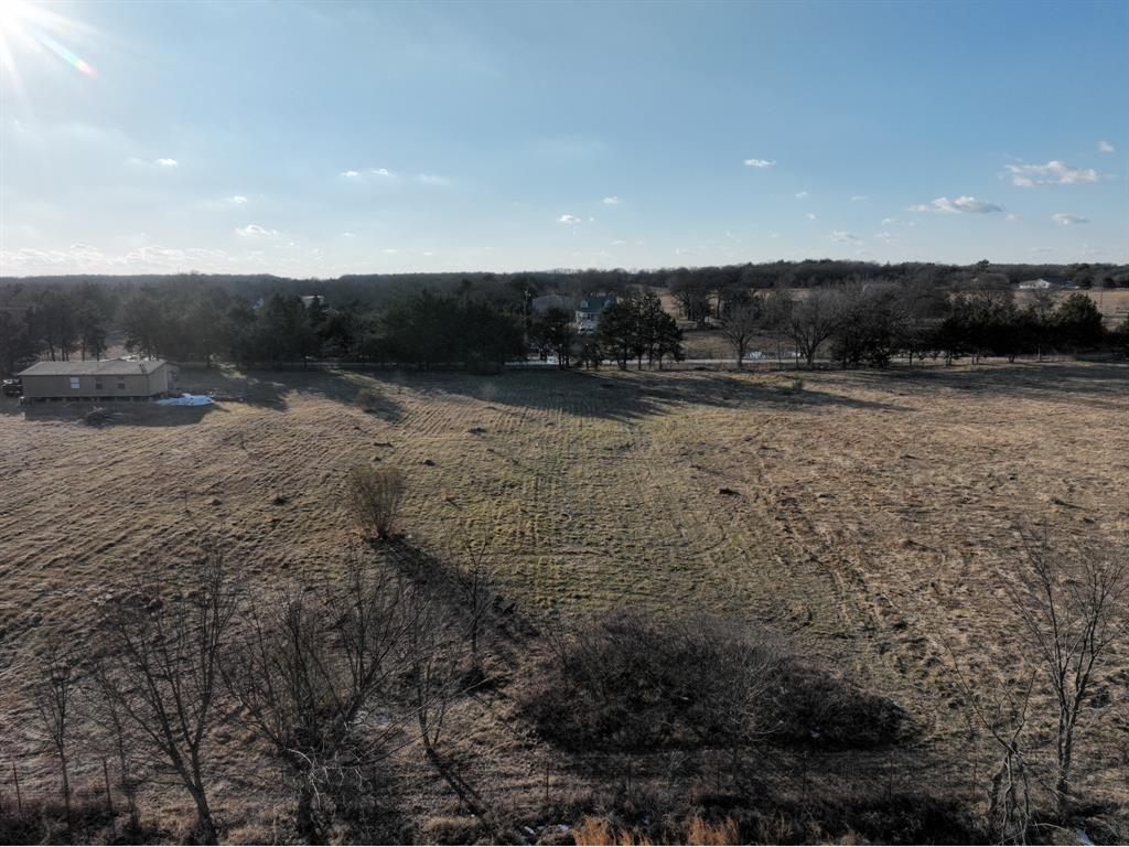 200 The Oil Road Gainesville, TX 76240 - Photo 6 of 6 Expansive open land with a distant treeline and clear sky backdrop