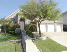 3704 Hawk Ridge Street Round Rock, TX 78665 - Photo 1 of 1 a front view of a house with garden