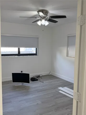 a view of a livingroom with wooden floor