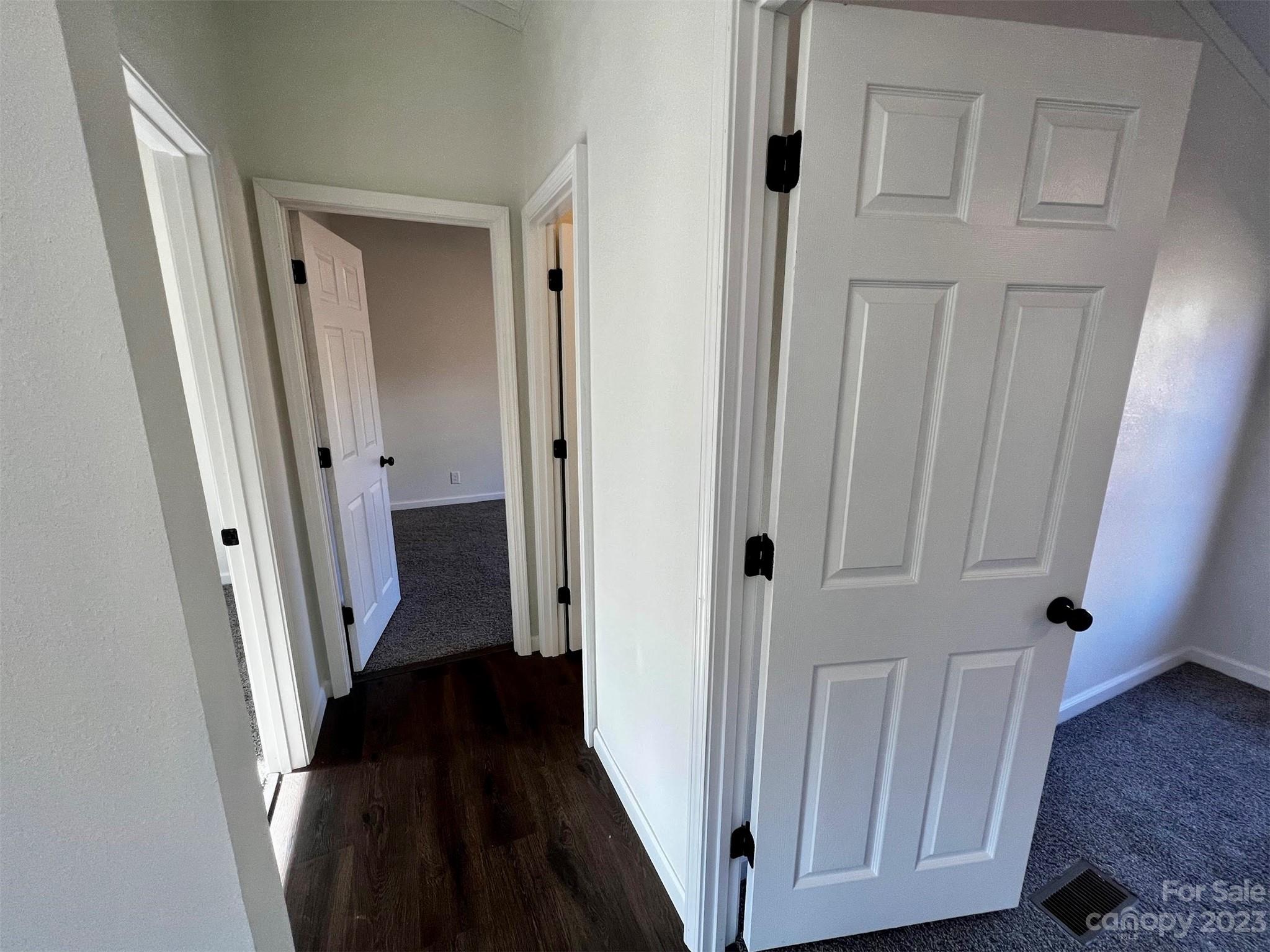 570 Scottdale Road Canton, NC 28716 - Photo 28 of 44 a view of a hallway with wooden floor and staircase