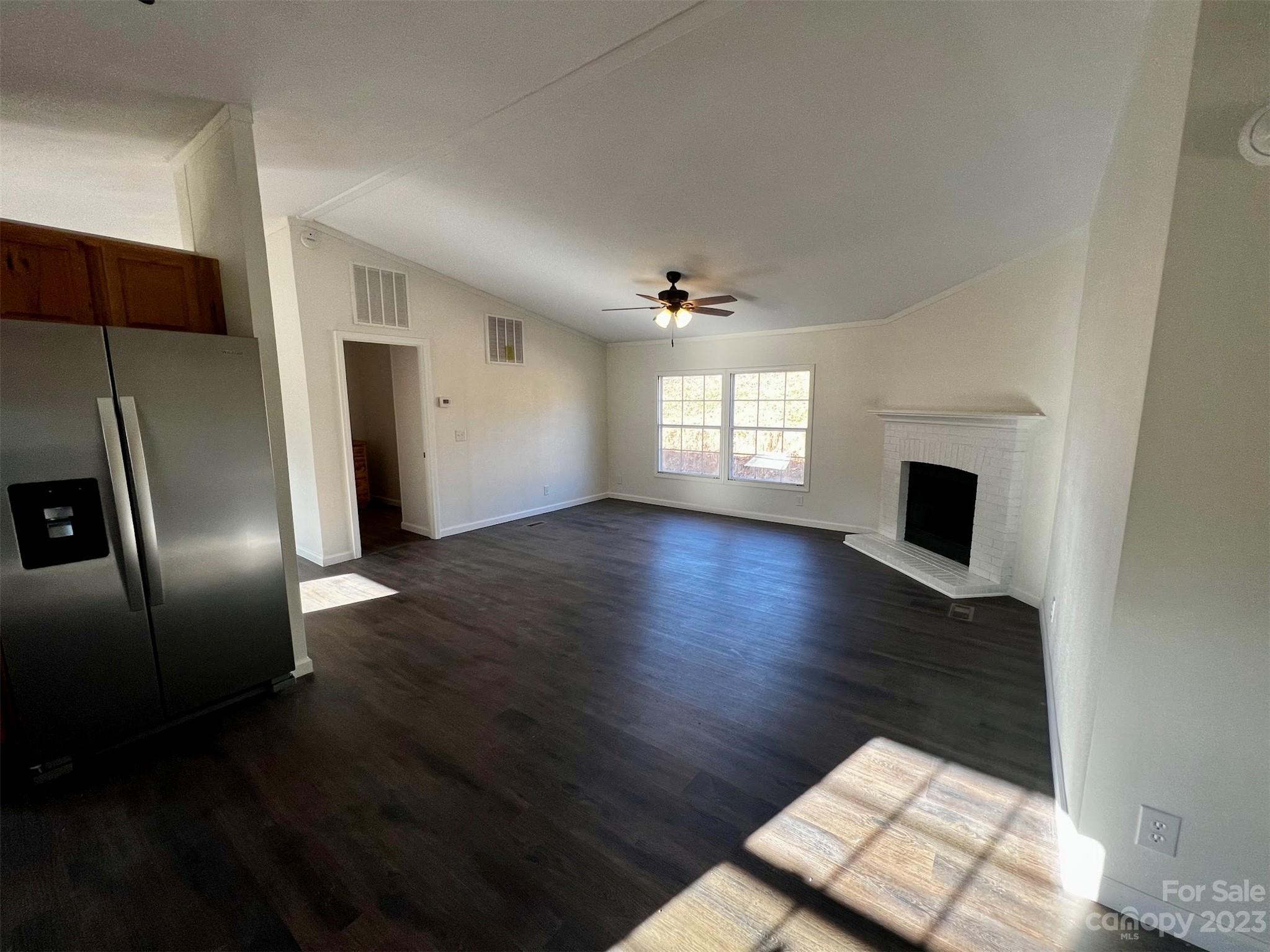 570 Scottdale Road Canton, NC 28716 - Photo 32 of 44 a view of an empty room with wooden floor and a window