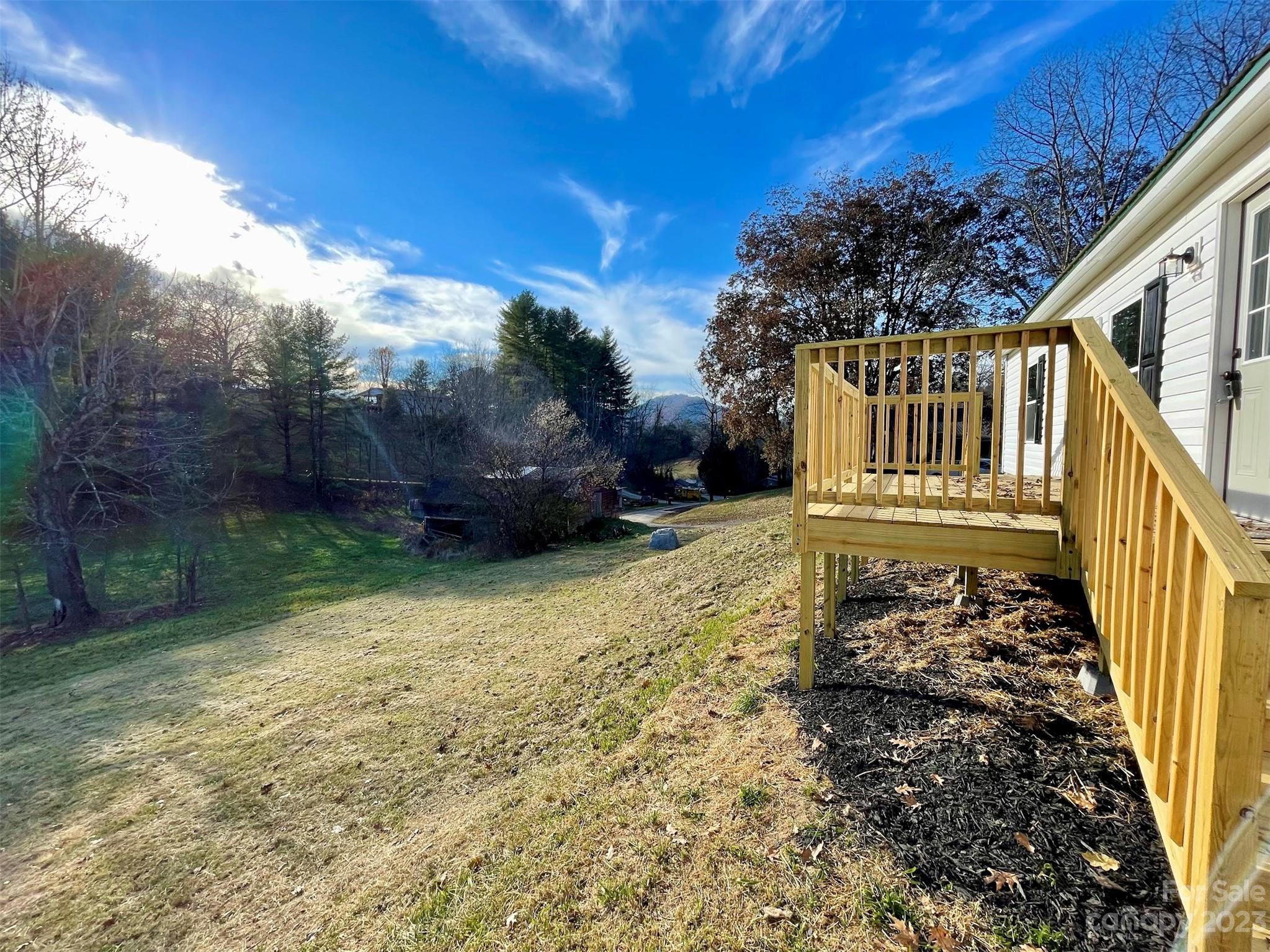 570 Scottdale Road Canton, NC 28716 - Photo 36 of 44 a view of a yard with wooden fence